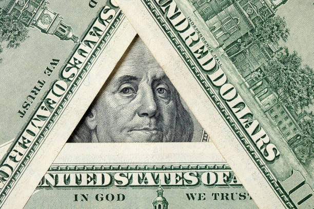 istock Triangle made of $100 bills with Benjamin Franklin inside 1205061340