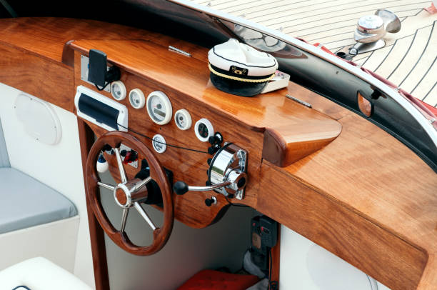 istock steering wheel and wooden control panel on yacht 1205063330