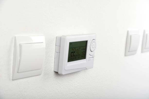 istock Modern heat thermostat on a white background 1205064992