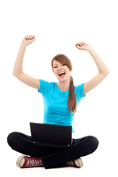 istock Female student raise arms sitting with laptop 120506596