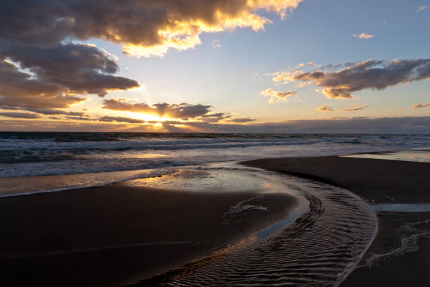 Sunrise Textures Cocoa Beach Florida, January 9, 2020 Exposure: 1/8 sec at f / 22, Focal Length: 24 mm, ISO 50 michael stephen wills cocoa beach surf sunrise stock pictures, royalty-free photos & images