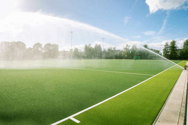 Sports field is watered by a sprinkler system