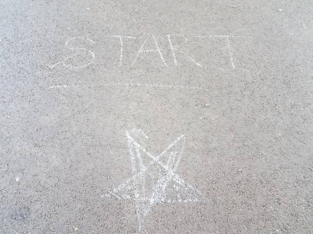 istock start sign on ground or asphalt with star 1205073305