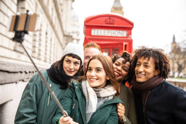 istock Friends taking a selfie agains a London typical phone booth 1205076723