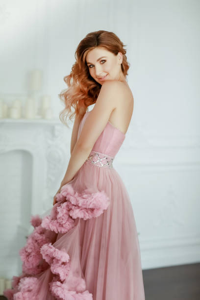 istock Woman model dressed in a elegant evening classic dress 1205077473