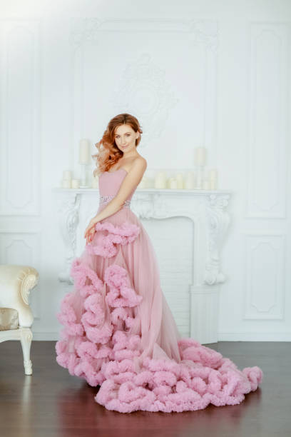 istock Woman model dressed in a elegant evening classic dress 1205077485