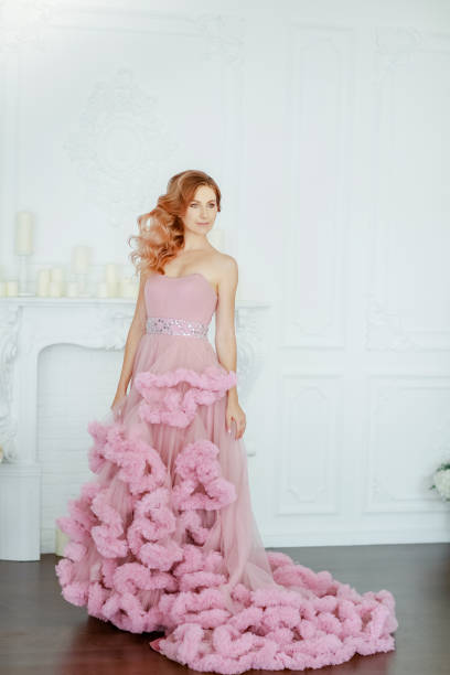 istock Woman model dressed in a elegant evening classic dress 1205077495