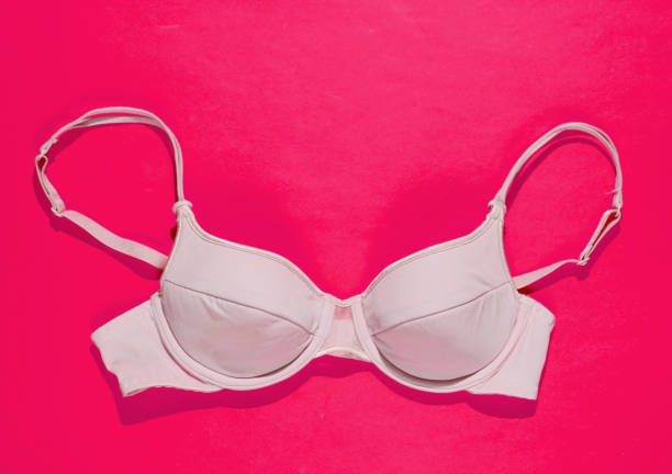 istock Comfortable women's bra on pink background. Beautiful underwear. Top view 1205077580