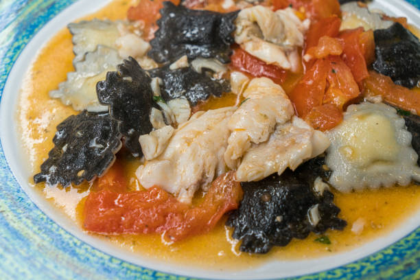 istock Delicious fish ravioli pasta with tomato sauce 1205078475