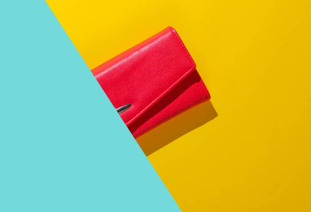 istock Half of Red leather wallet on blue yellow background. Top view 1205080734
