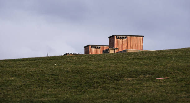 istock Building blocks roof behind the hill 1205085732