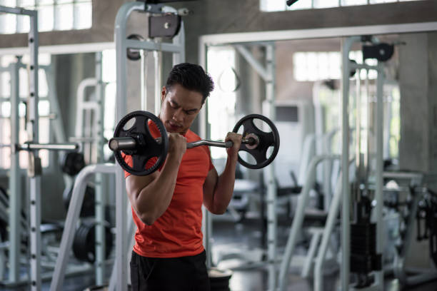 istock man exercise barbell weights at gym 1205087571