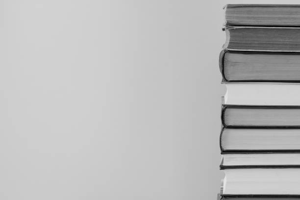 background with a large stack of new and old books and place for text