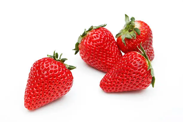 Photo of Four strawberry on white background
