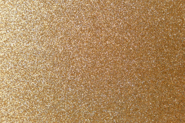 istock Golden glitter texture. Christmas abstract background. Abstract Bright gold shiny background. Bright halftone pattern. Light paper texture for luxury elegant backdrop design wallpaper or template 1205090173