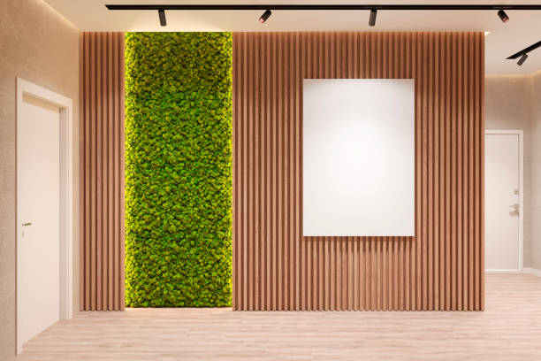 Modern eco-style interior with a vertical poster on a wooden wall, backlit moss, spotlights in the ceiling, two doors and a wooden floor. Front view.