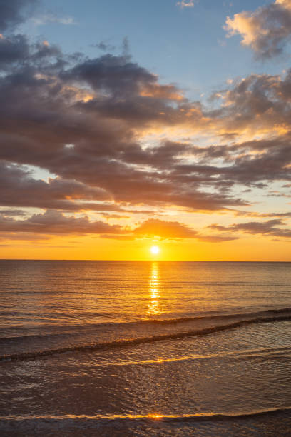 istock Sun Setting on Sea Horizon at Golden Hour Sunset 1205092096