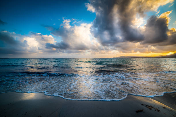 Dark clouds over the sea at sunset. Sardinia, Italy
