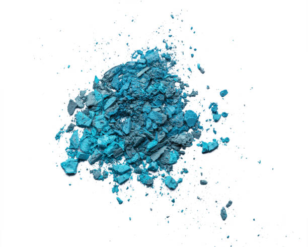 istock Broken eye shadow isolated on a white background. Makeup cosmetic texture close up. 1205092254