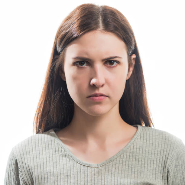 istock young angry brunet woman portrait 1205092352