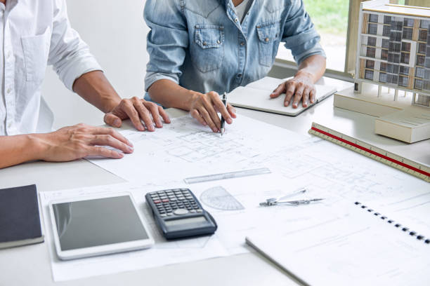 istock Architecture Engineer Teamwork Meeting, Drawing and working for architectural project and engineering tools on workplace, concept of work on technical drawings 1205094771