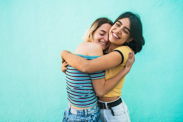 istock Loving lesbian couple hugging. 1205095121