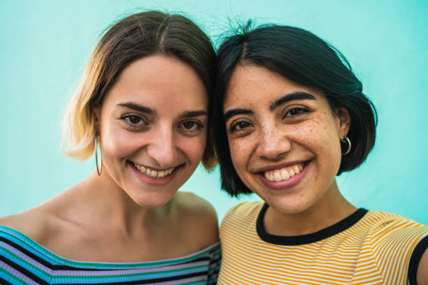 istock Lovely lesbian couple taking a selfie. 1205095123
