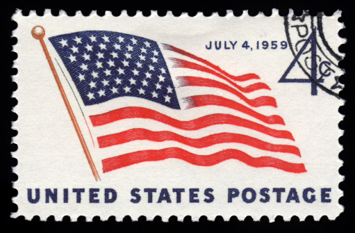 USA  postage stamp with an image of the Stars & Stripes American Flag celebrating America Independence Day on July 4th