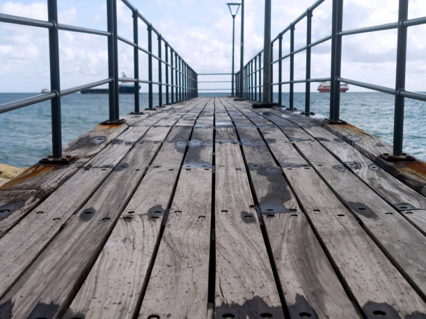 istock Empty wooden sea pier 1205099279