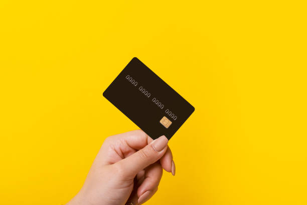 istock Female hand holding credit card 1205100002