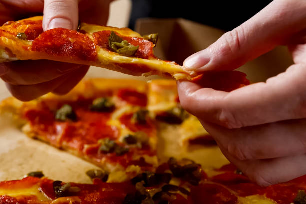 istock Delivered pizza in box, delicious pizza. 1205100228