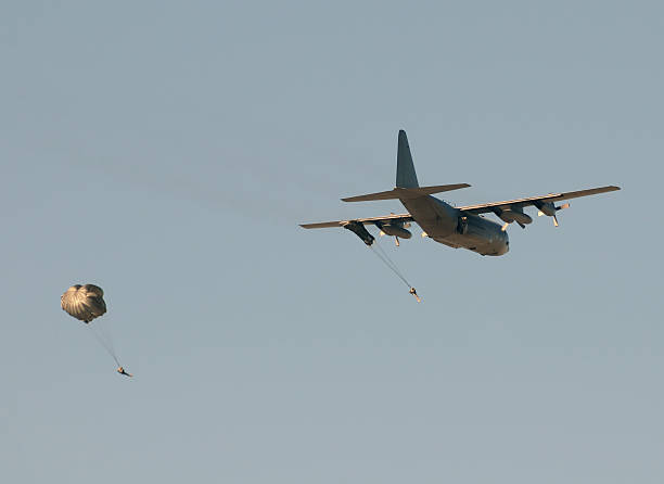 istock Transport airplane dropping soldiers 120510513