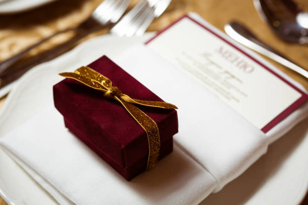 istock Wedding favor in an elegant gift box. Table setting. Shallow dof 1205105612