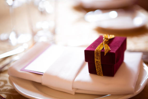istock Wedding favor in an elegant gift box. Table setting 1205105675
