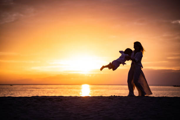 istock Mother and son enjoying at the beach 1205110656