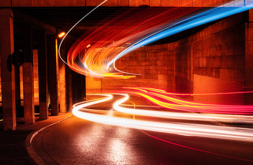 This photo is a composition of a car and bus light trails under a recognised bridge in Montjuic, Girona. Represents the new technology and speed movement.