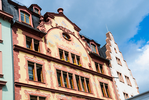 The beautiful painted adornments of a 16th century building facing market square in Mainz, Germany
