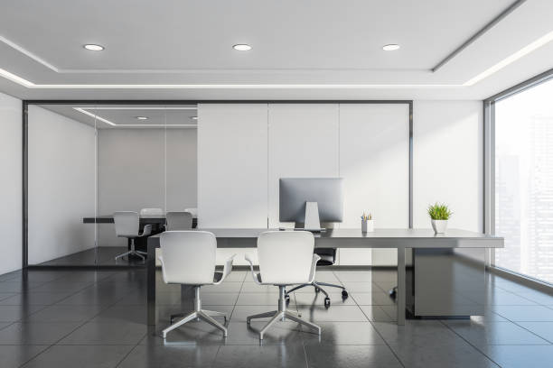 istock White CEO office with meeting room 1205112072