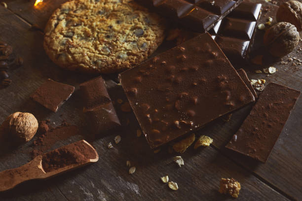 istock Chocolate Chip Cookie, chocolate on wooden background 1205112152