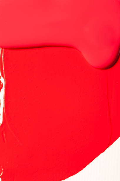 Red cosmetics for a woman. A sample on a white background.