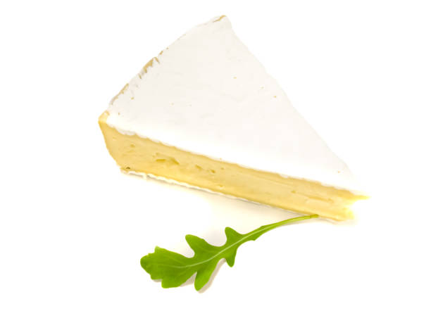 istock Brie type of cheese. Fresh Brie cheese and with green leavesrucola. 1205113877