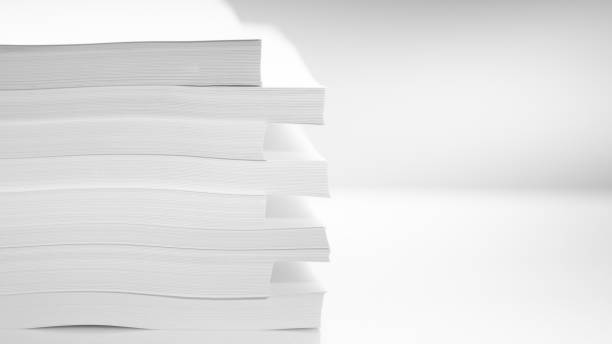 Several stacks of white paper on a white background