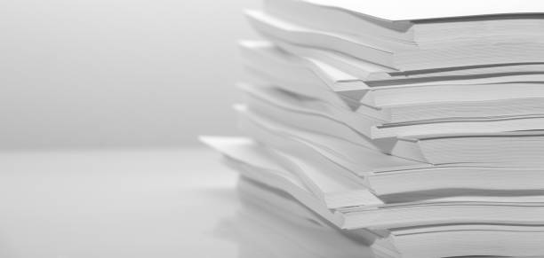 istock Several stacks of white paper on a white background 1205114558