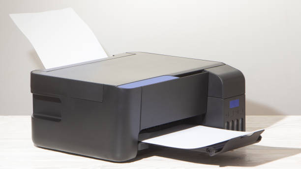 istock Black copier on white wooden table, closeup. 1205114796