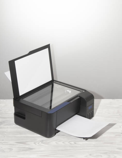 istock Black copier on white wooden table, closeup. 1205114800