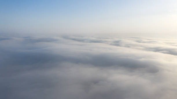 istock Yellow and blue dawn over clouds, concept, travel and leisure. 1205115078