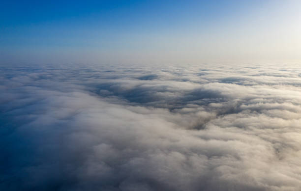 istock Yellow and blue dawn over clouds, concept, travel and leisure. 1205115098
