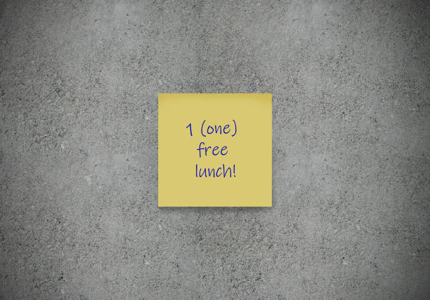 Detail of yellow page marker fixed on a white background - Flat Lay.