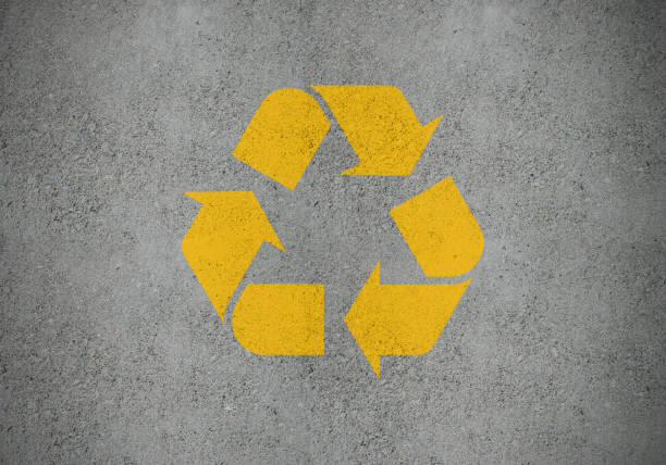 istock Yellow recycling symbol on concrete surface, as road marking 1205116296