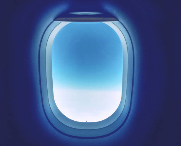 Blue sky window plane white cabin at window seat stock photo